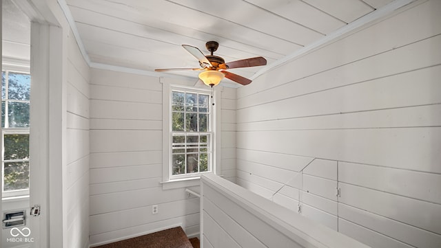 interior space featuring ceiling fan