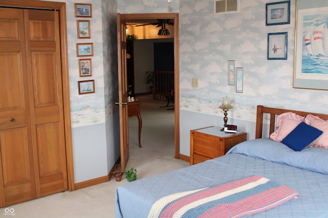 carpeted bedroom featuring a closet