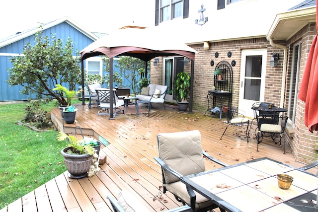 wooden terrace with an outdoor living space, a yard, and outdoor dining space