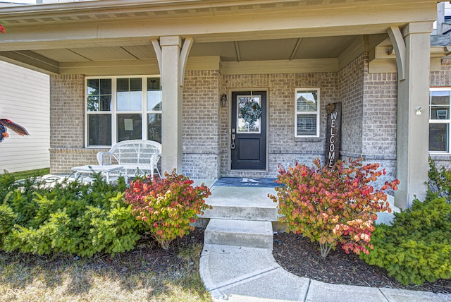 entrance to property with a porch