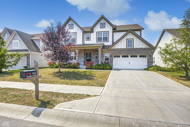 view of front of house with a front yard and a garage