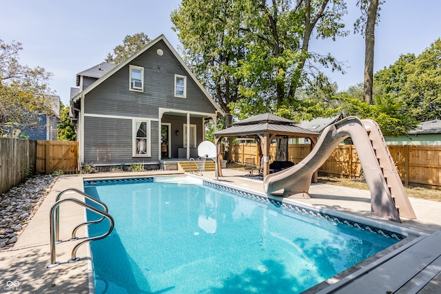 view of pool featuring a water slide, a patio, and a gazebo