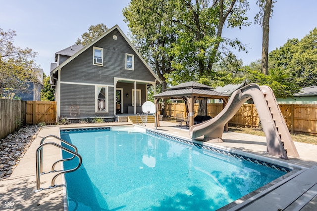 1715 Alabama St, Indianapolis, IN 46202 - rear view of property featuring a fenced backyard, a gazebo, a patio, and a fenced in pool