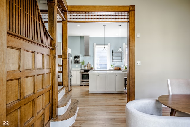 foyer entrance with light wood-type flooring