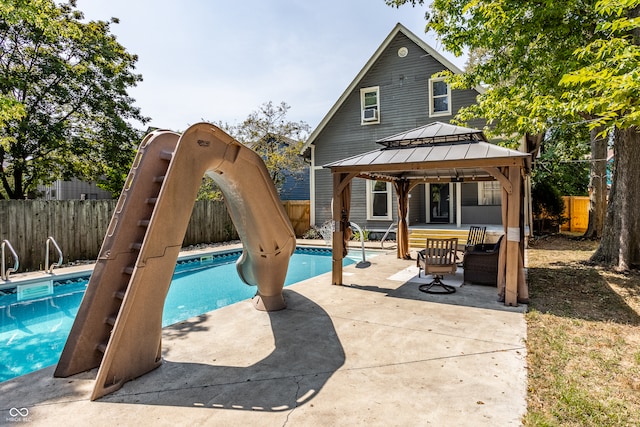 view of swimming pool with a patio and a gazebo