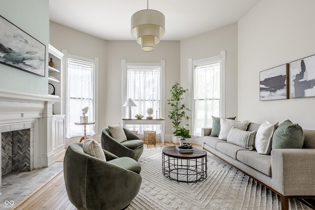 1715 Alabama St, Indianapolis, IN 46202 - living room with a fireplace, wood finished floors, and plenty of natural light
