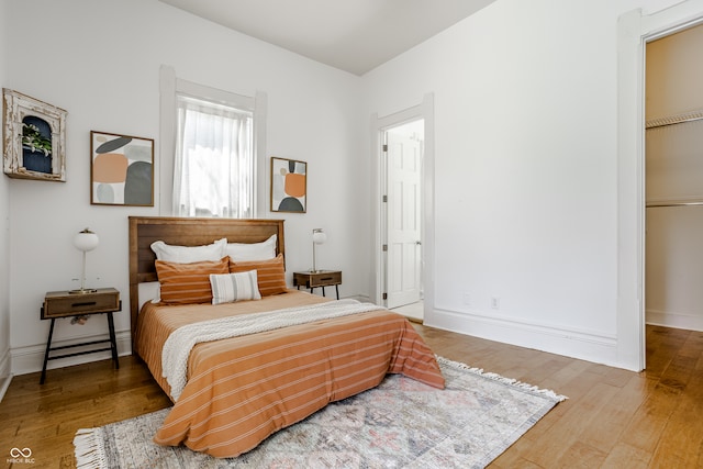 bedroom featuring a closet and wood-type flooring