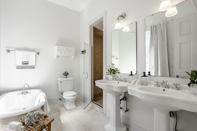 bathroom featuring separate shower and tub, toilet, and tile patterned floors