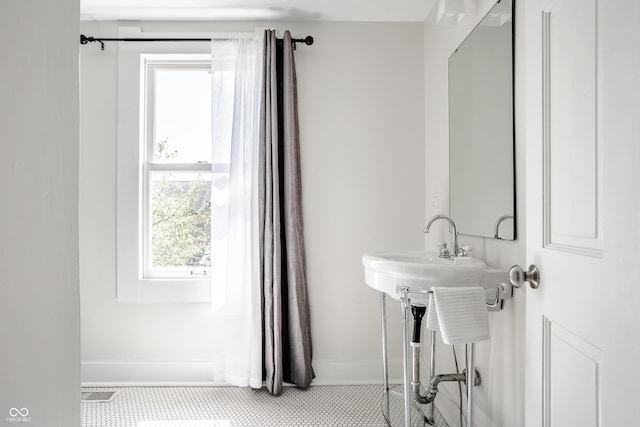 1715 Alabama St, Indianapolis, IN 46202 - bathroom featuring baseboards and tile patterned floors