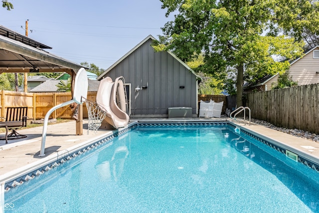 1715 Alabama St, Indianapolis, IN 46202 - view of swimming pool featuring a fenced in pool, a fenced backyard, a gazebo, a water slide, and a patio