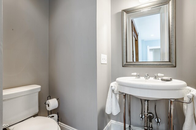 1715 Alabama St, Indianapolis, IN 46202 - bathroom featuring toilet and baseboards