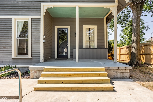 property entrance with a patio area