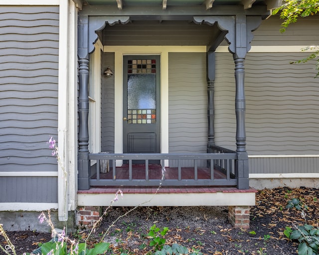 property entrance featuring covered porch