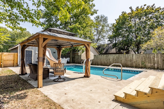 view of swimming pool featuring a patio area and a gazebo