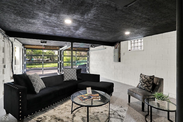 22 W 54th St, Indianapolis, IN 46208 - living room featuring concrete block wall and electric panel