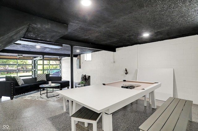 22 W 54th St, Indianapolis, IN 46208 - interior space featuring concrete block wall, recessed lighting, and speckled floor
