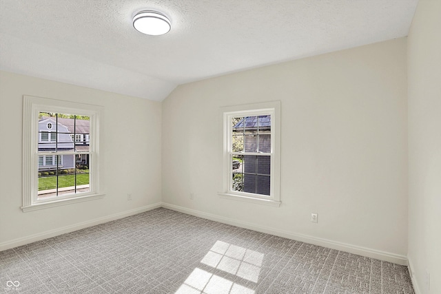 22 W 54th St, Indianapolis, IN 46208 - empty room with vaulted ceiling, light carpet, and baseboards
