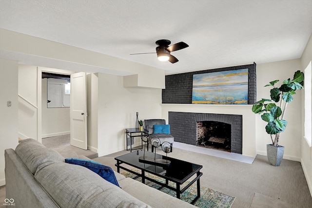 22 W 54th St, Indianapolis, IN 46208 - carpeted living room with baseboards, ceiling fan, and a brick fireplace