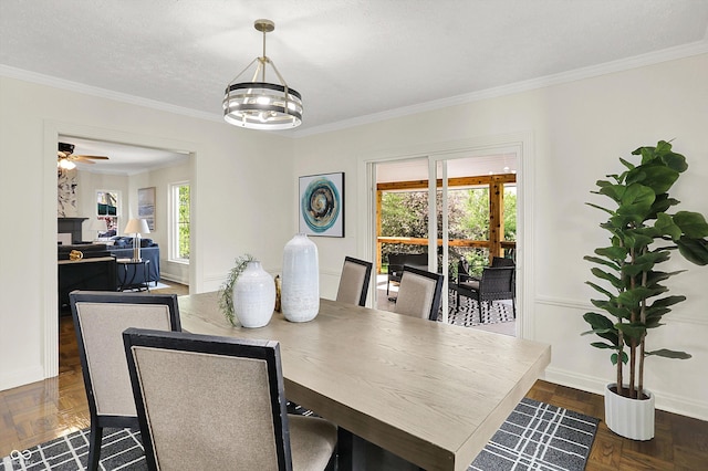 22 W 54th St, Indianapolis, IN 46208 - dining space featuring baseboards, ornamental molding, and ceiling fan with notable chandelier