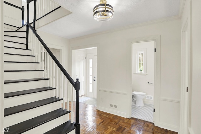 22 W 54th St, Indianapolis, IN 46208 - foyer entrance featuring visible vents, stairway, baseboards, and plenty of natural light