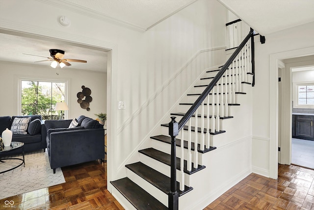 22 W 54th St, Indianapolis, IN 46208 - staircase featuring a ceiling fan and baseboards