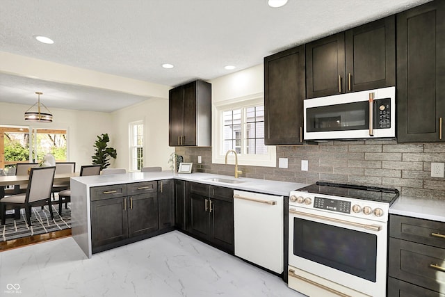 22 W 54th St, Indianapolis, IN 46208 - kitchen featuring a healthy amount of sunlight, range with electric stovetop, white dishwasher, marble finish floor, and a sink