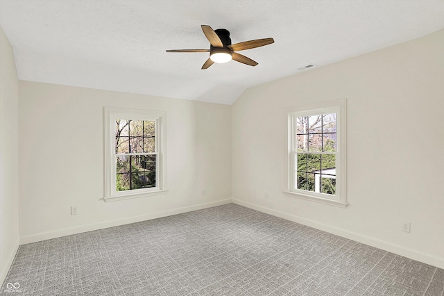 22 W 54th St, Indianapolis, IN 46208 - spare room with a wealth of natural light, visible vents, a ceiling fan, and vaulted ceiling