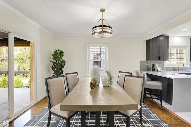 22 W 54th St, Indianapolis, IN 46208 - dining area with crown molding, a textured ceiling, and a notable chandelier