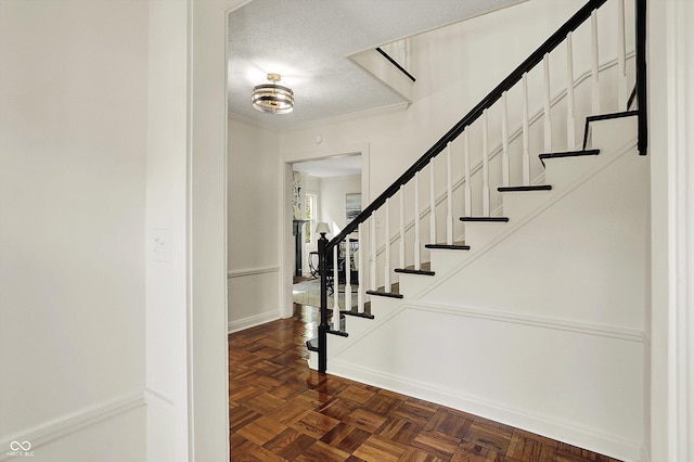 22 W 54th St, Indianapolis, IN 46208 - staircase with a textured ceiling and baseboards