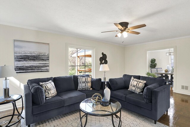22 W 54th St, Indianapolis, IN 46208 - living room with a textured ceiling, visible vents, a ceiling fan, and crown molding