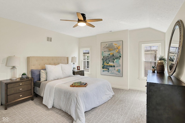 22 W 54th St, Indianapolis, IN 46208 - bedroom with light colored carpet, visible vents, ceiling fan, baseboards, and vaulted ceiling