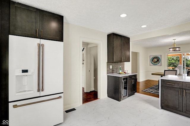 22 W 54th St, Indianapolis, IN 46208 - kitchen with recessed lighting, high end fridge, light countertops, and marble finish floor