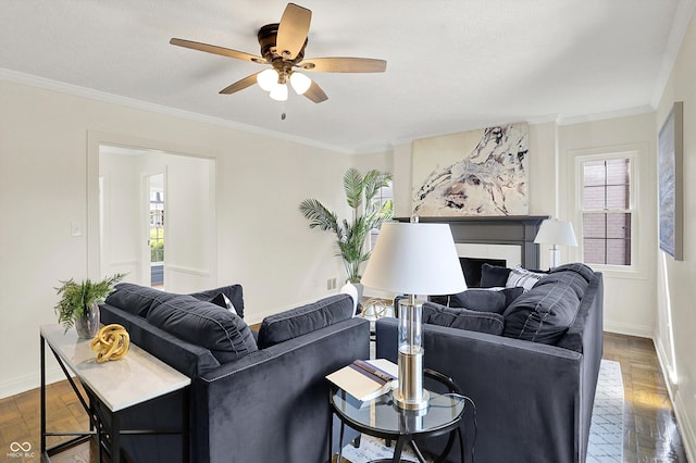 22 W 54th St, Indianapolis, IN 46208 - living room with baseboards, ornamental molding, ceiling fan, and a tiled fireplace