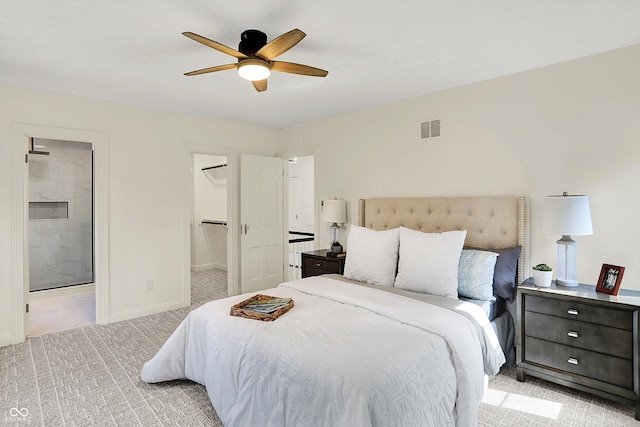 22 W 54th St, Indianapolis, IN 46208 - bedroom with ceiling fan, visible vents, ensuite bathroom, baseboards, and light carpet