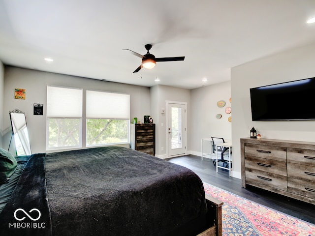 bedroom featuring ceiling fan and dark hardwood / wood-style floors