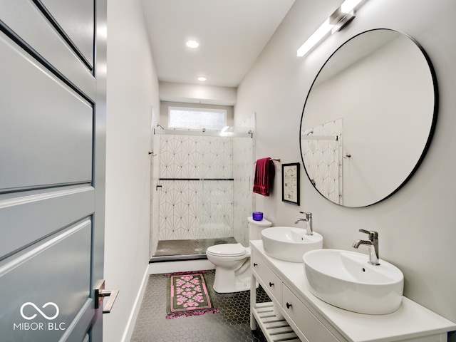 bathroom featuring tiled shower, tile patterned flooring, toilet, and vanity