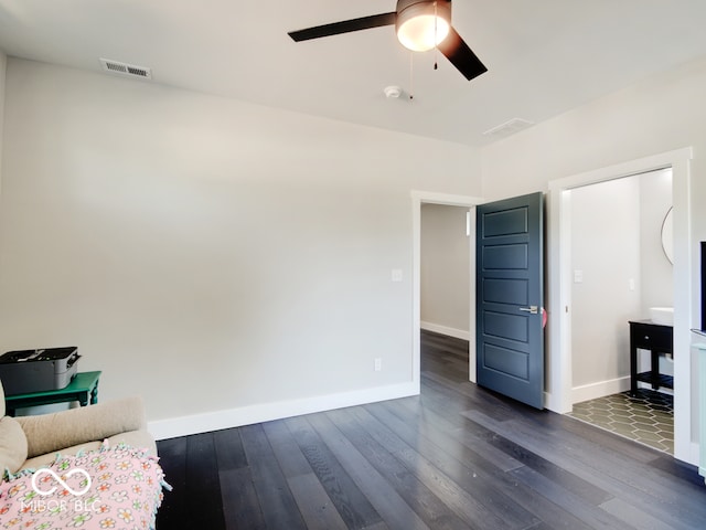 interior space featuring ceiling fan and dark hardwood / wood-style floors