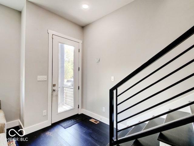 entrance foyer featuring dark wood-type flooring