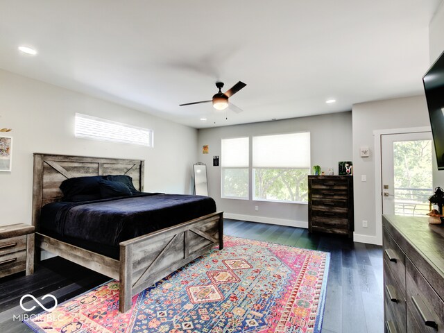 bedroom featuring ceiling fan, dark hardwood / wood-style flooring, and access to outside