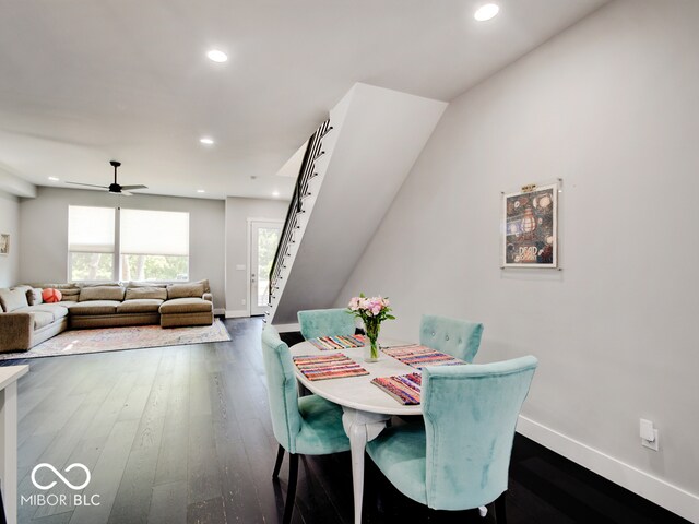 dining space featuring ceiling fan and dark hardwood / wood-style floors