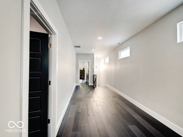 corridor featuring dark wood-type flooring