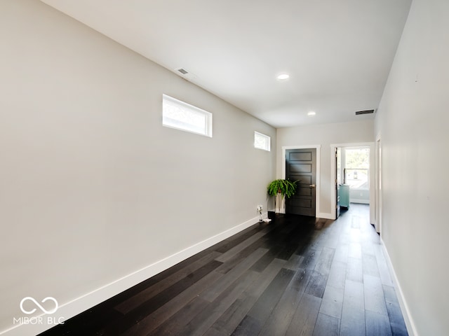 entrance foyer with dark hardwood / wood-style floors