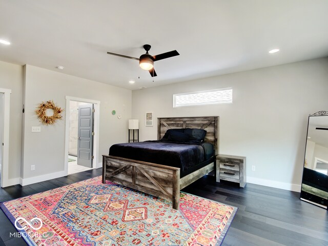 bedroom with ceiling fan and dark hardwood / wood-style floors