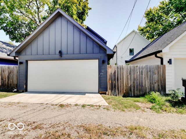 view of front of property with an outdoor structure and a garage