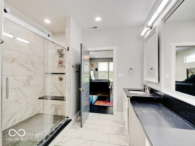 bathroom with an enclosed shower and vanity