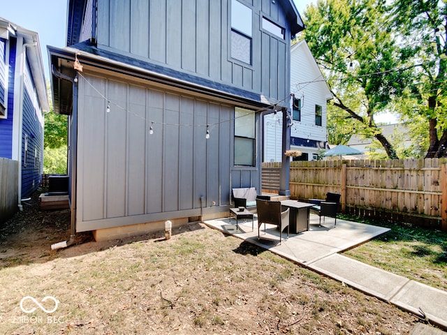 back of property featuring a patio area