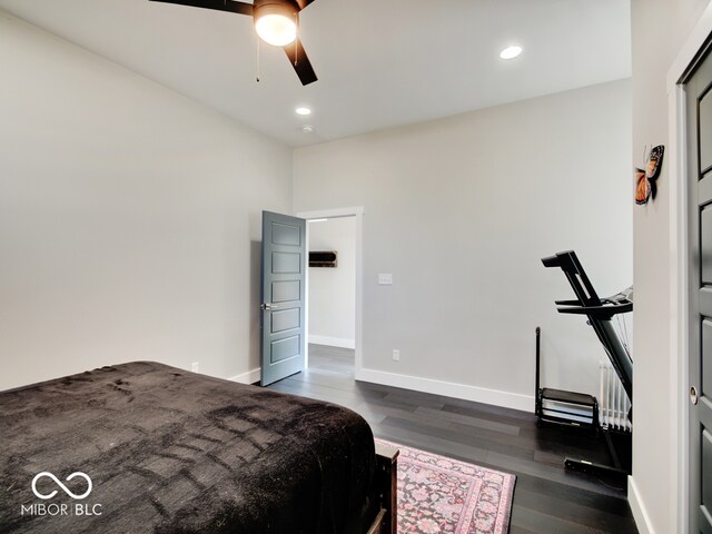 bedroom with ceiling fan and dark hardwood / wood-style floors