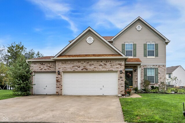 view of front facade with a garage and a front lawn