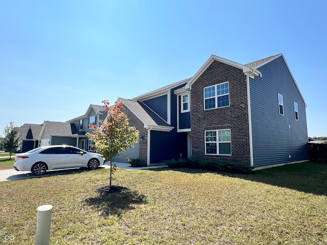 view of front facade with a garage and a front lawn