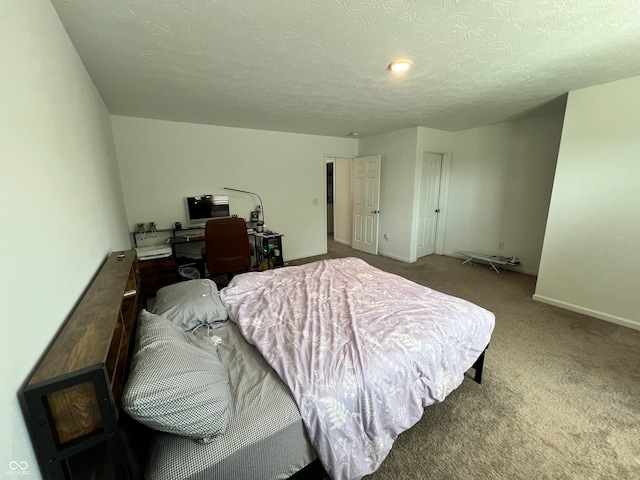 carpeted bedroom with a textured ceiling